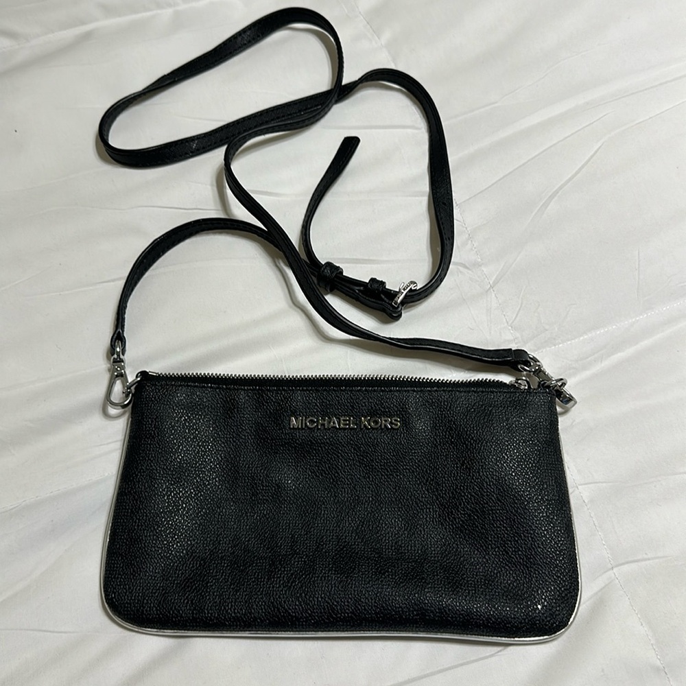 Michael Kors Crossbody, practically new!  Silver trim with silver zipper